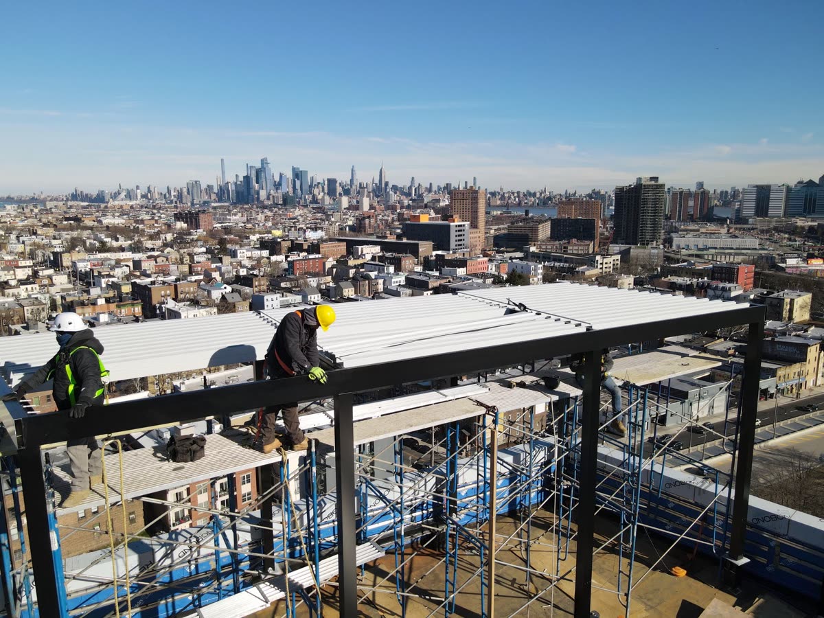 Breslow crew installing a louvered roof system on a rooftop — professional installation, not a DIY kit