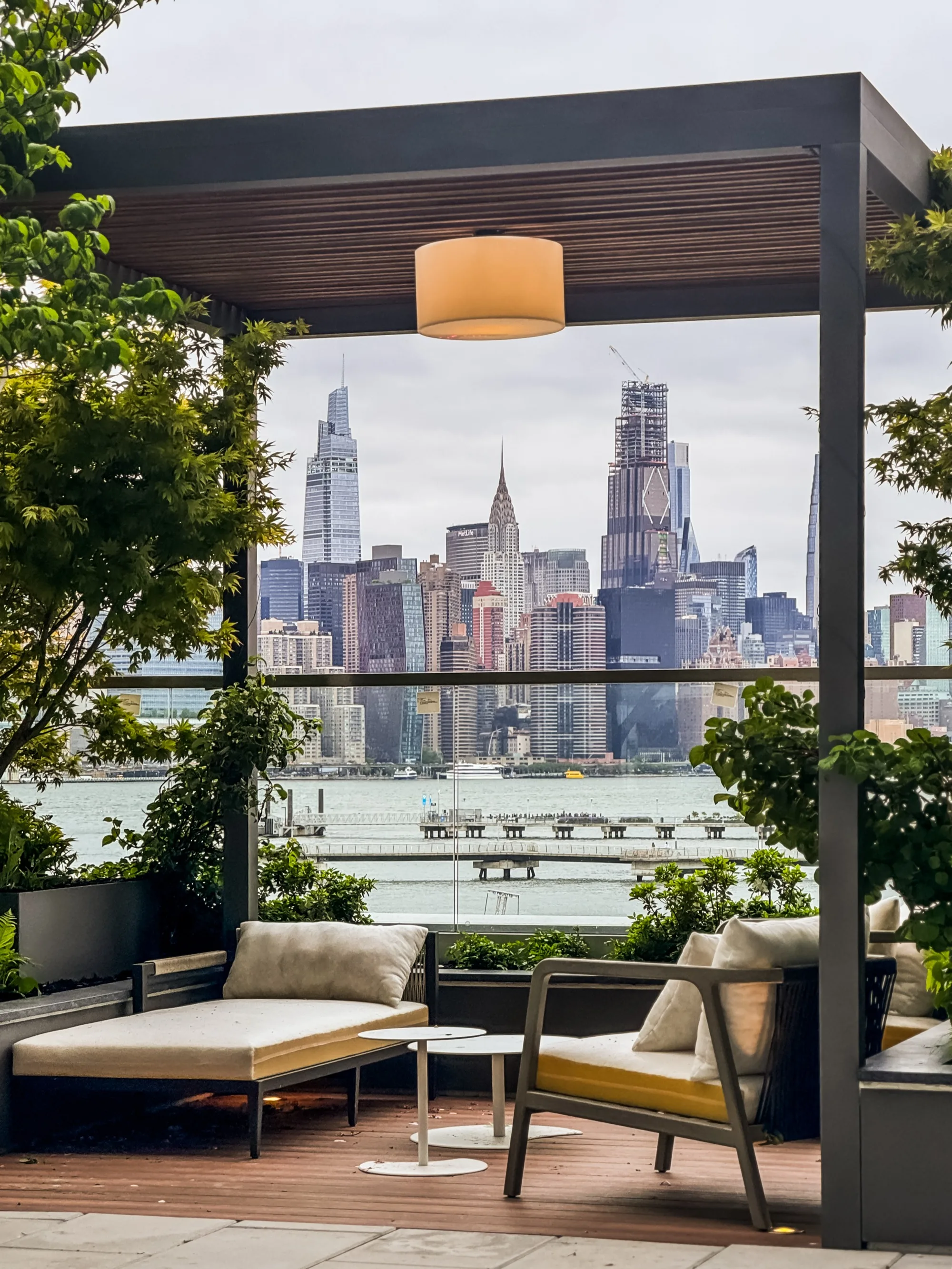Commercial rooftop pergola installation with city skyline
