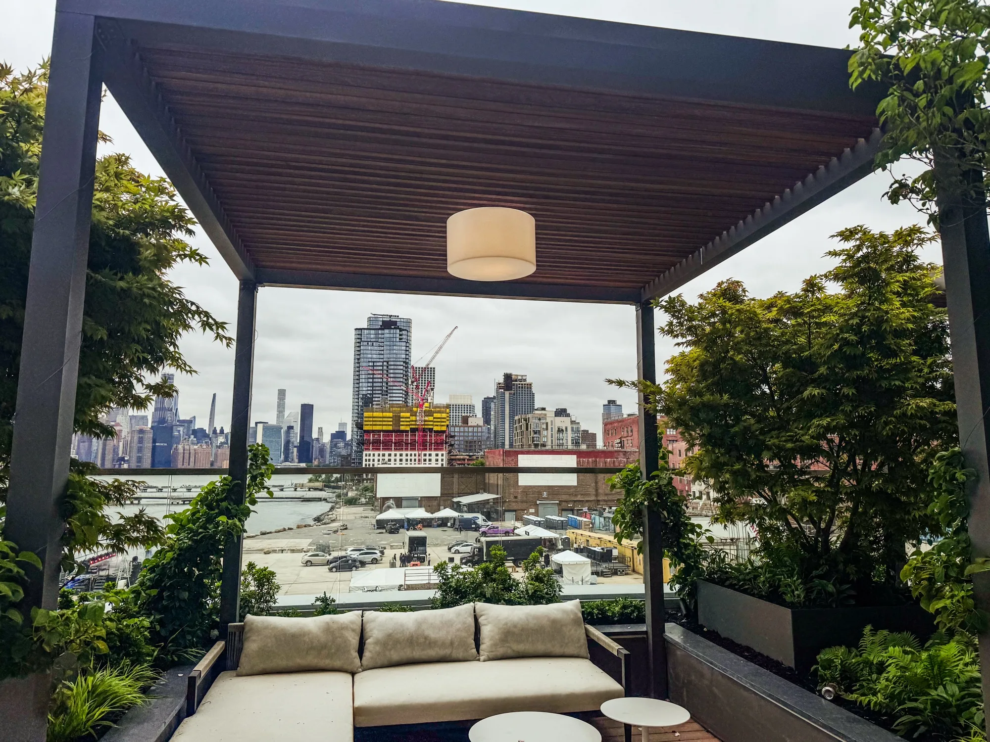 City skyline viewed through commercial pergola louvers