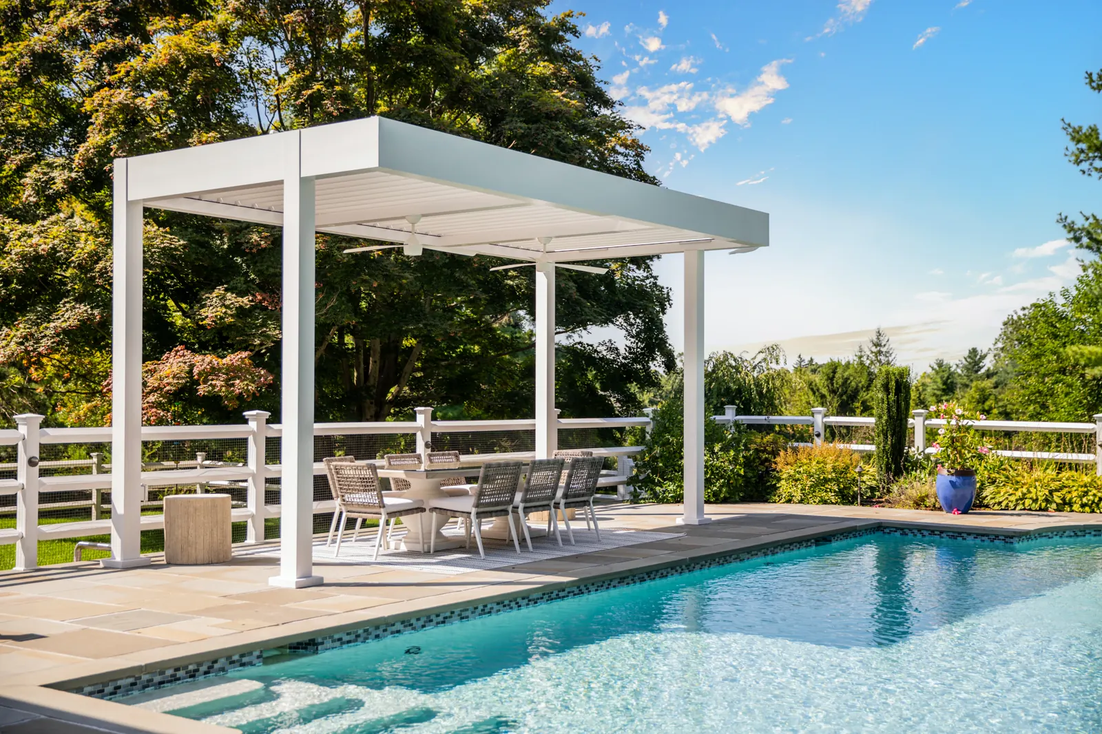 Modern motorized pergola with pool