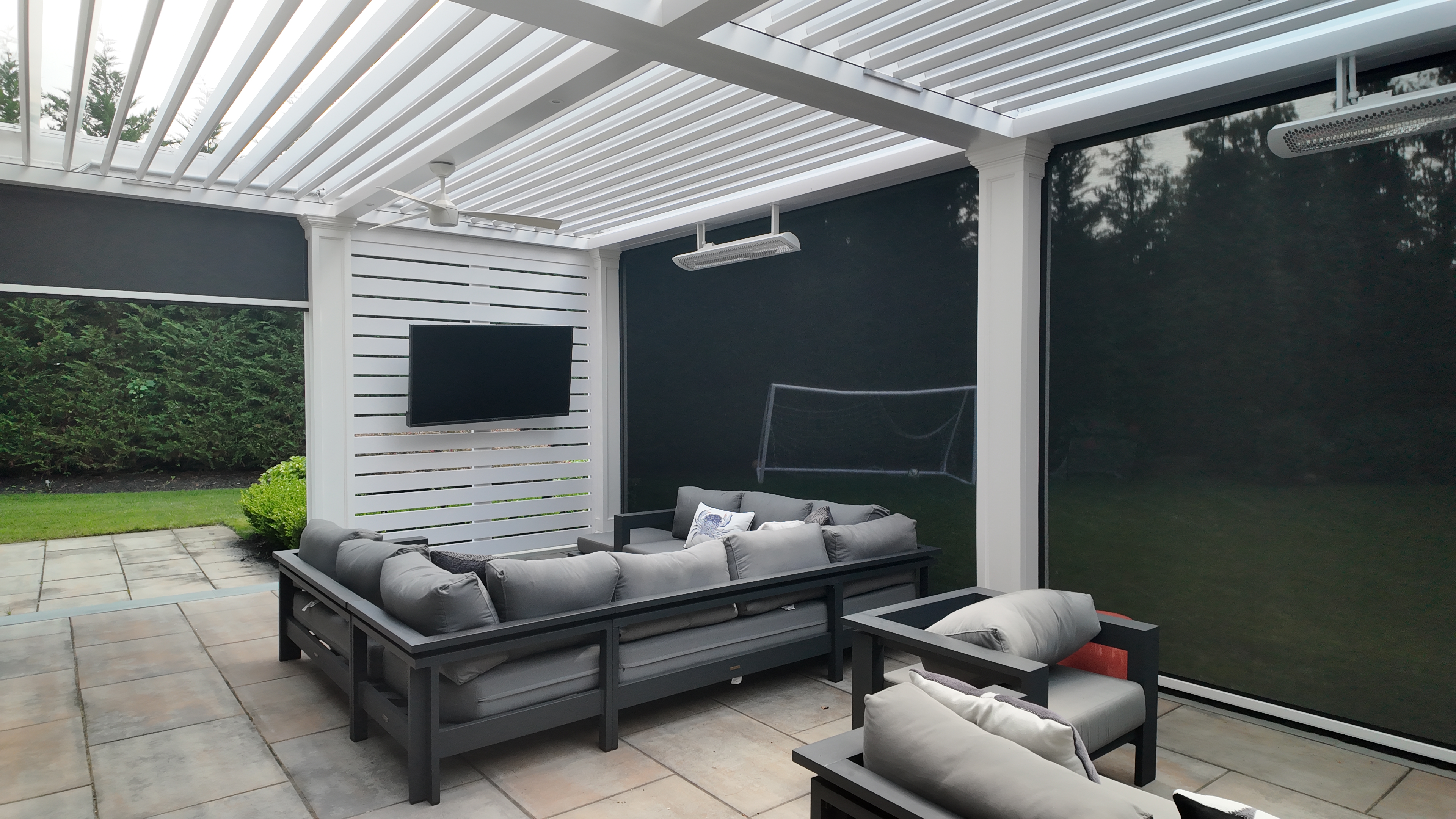 Custom Transitional Column Azenco Motorized Pergola with Concealed Motorized Screen shades, and Privacy wall with a TV mount, Manhasset NY