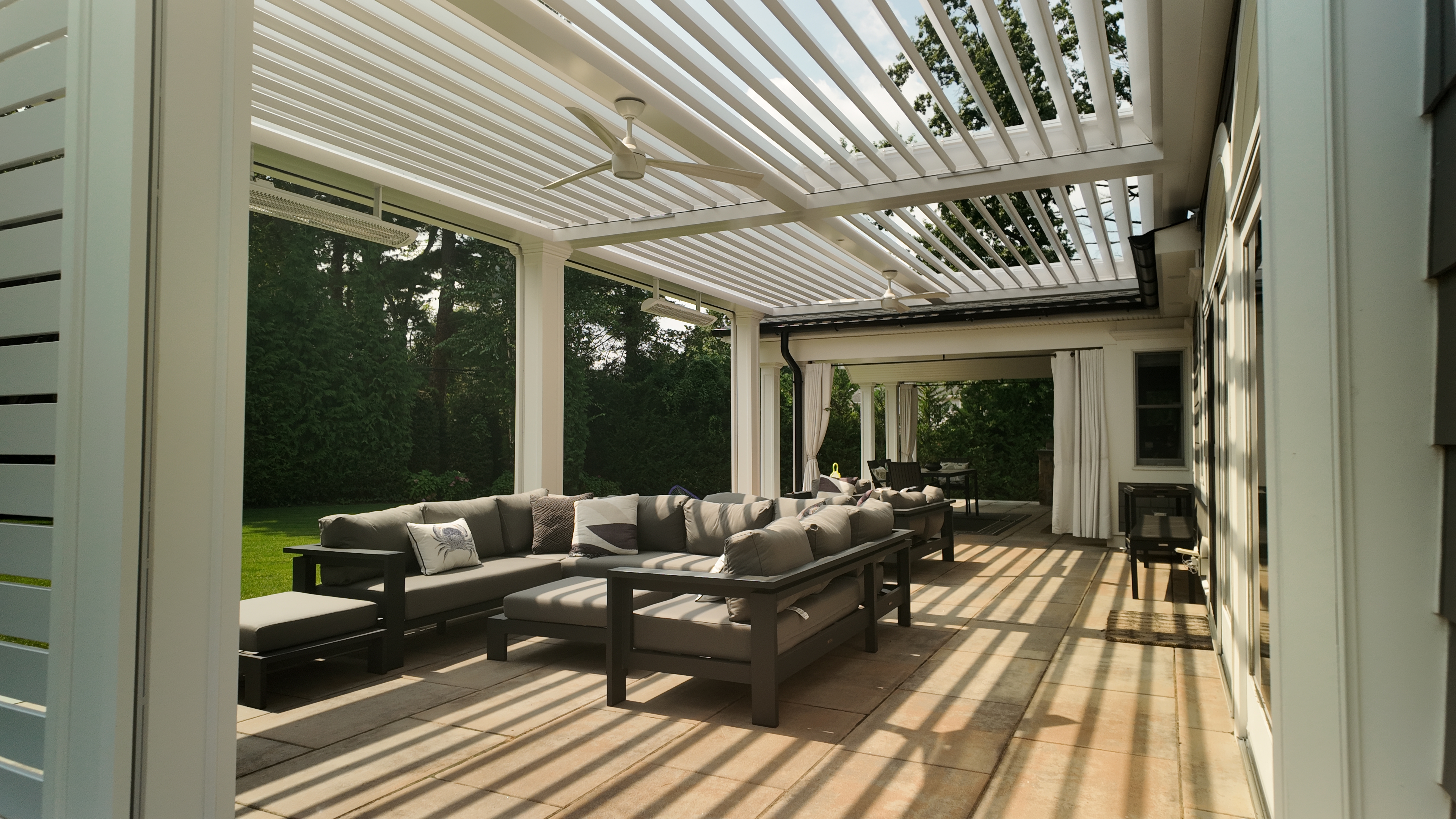 Custom Transitional Column Azenco Motorized Pergola with Concealed Motorized Screen shades, and Privacy wall with a TV mount, Manhasset NY