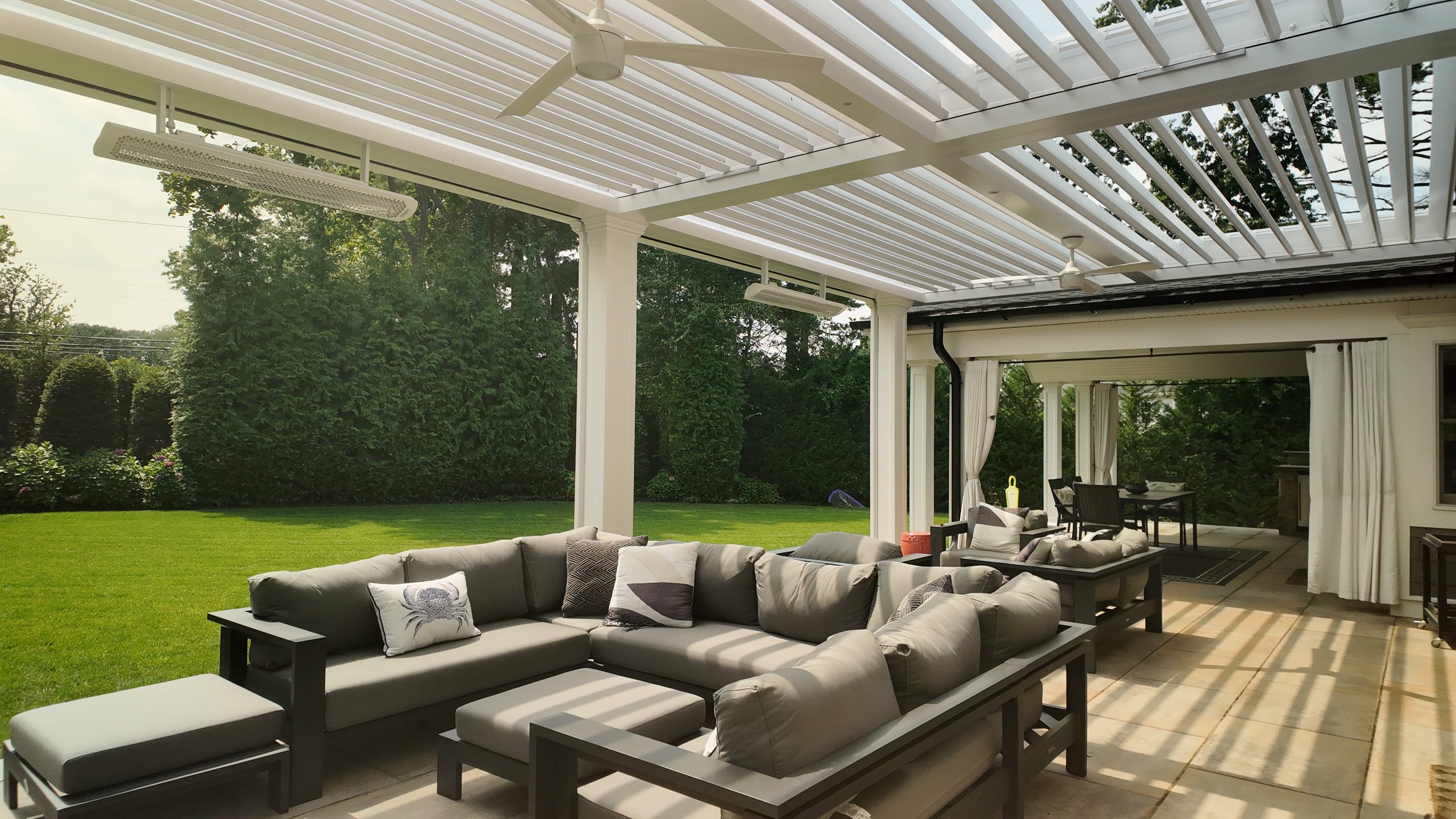 Custom Transitional Column Azenco Motorized Pergola with Concealed Motorized Screen shades, and Privacy wall with a TV mount, Manhasset NY