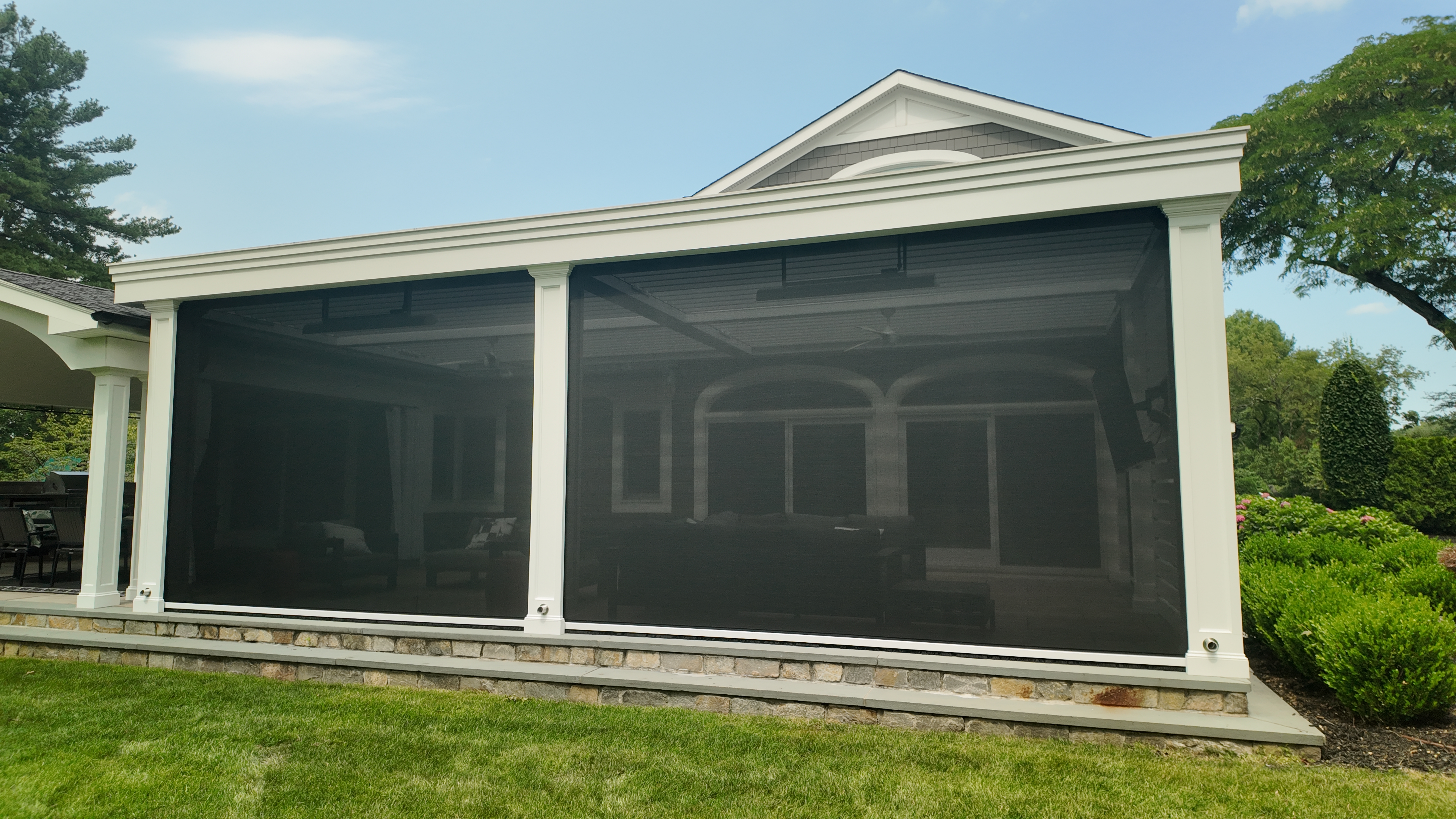 Custom Transitional Column Azenco Motorized Pergola with Concealed Motorized Screen shades, and Privacy wall with a TV mount, Manhasset NY