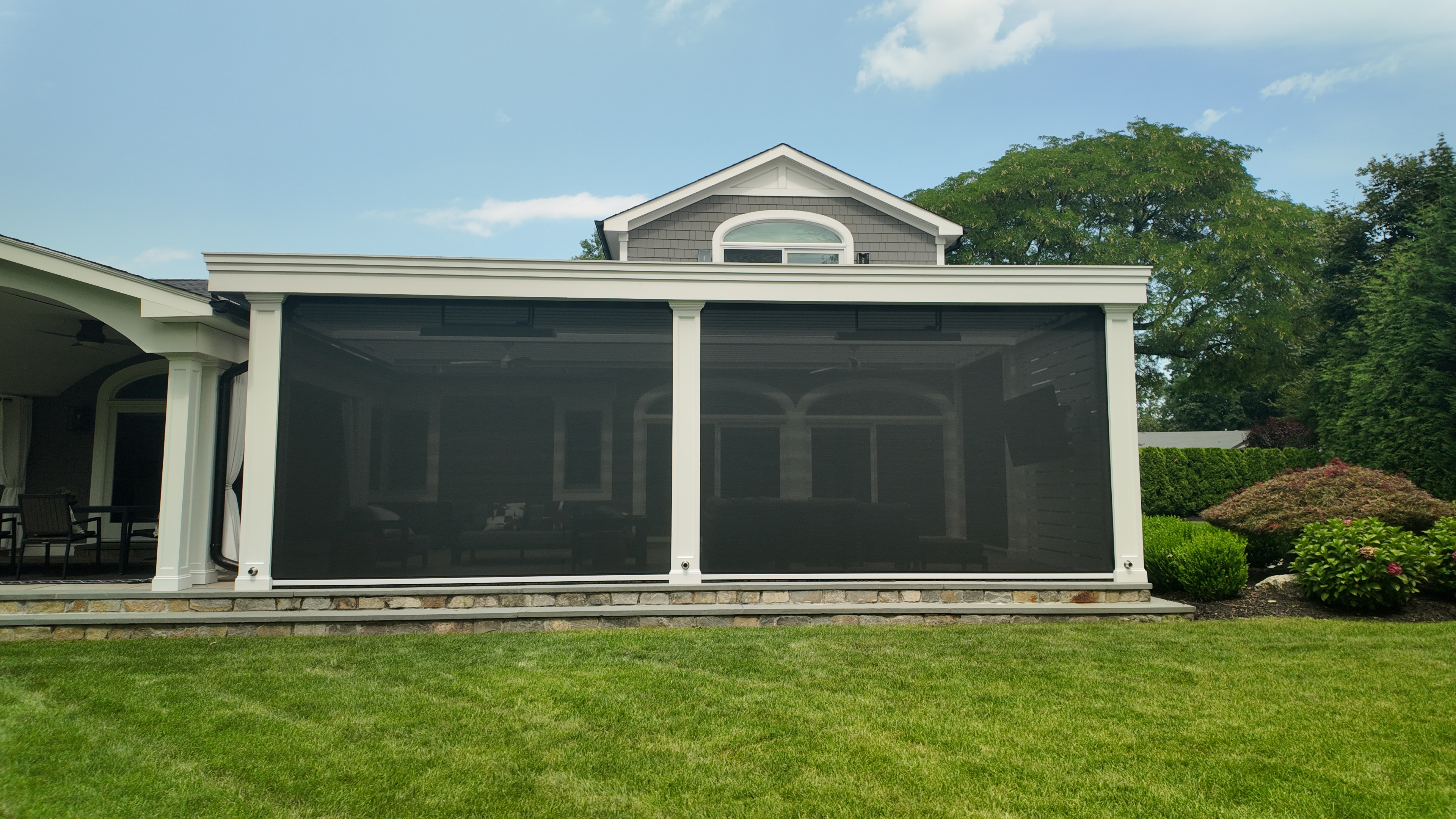 Custom Transitional Column Azenco Motorized Pergola with Concealed Motorized Screen shades, and Privacy wall with a TV mount, Manhasset NY