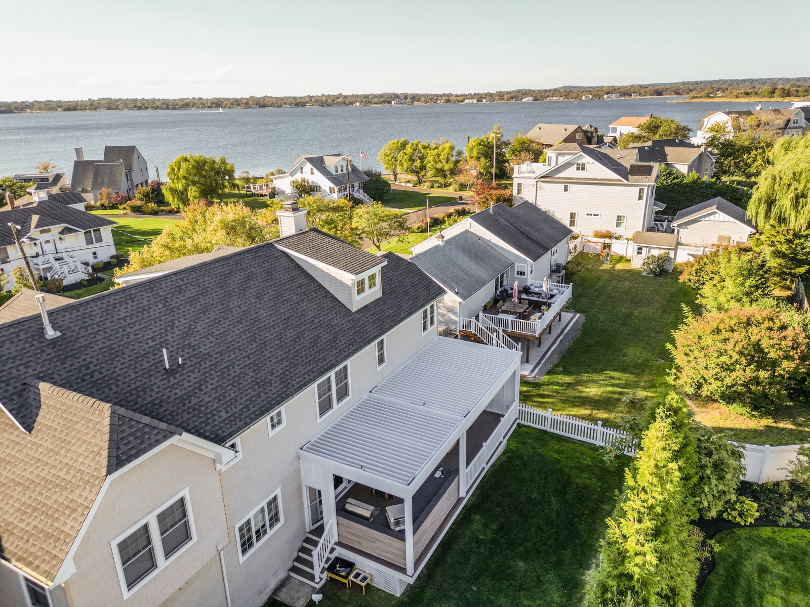 Monmouth Beach, NJ deck-mounted louvered roof + tv wall + outdoor kitchen — detail view