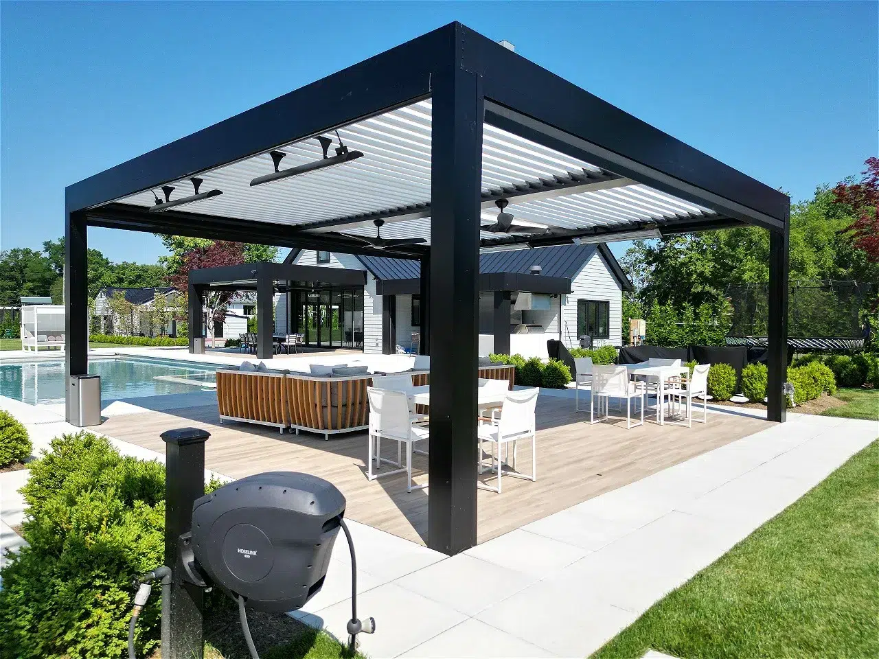 Modern black pergola beside pool