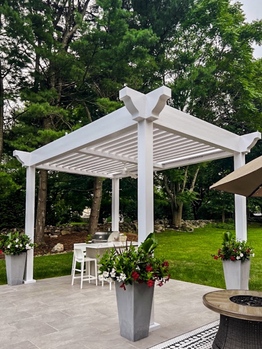 Classic louvered pergola with decorative finial and brackets in Weston, CT