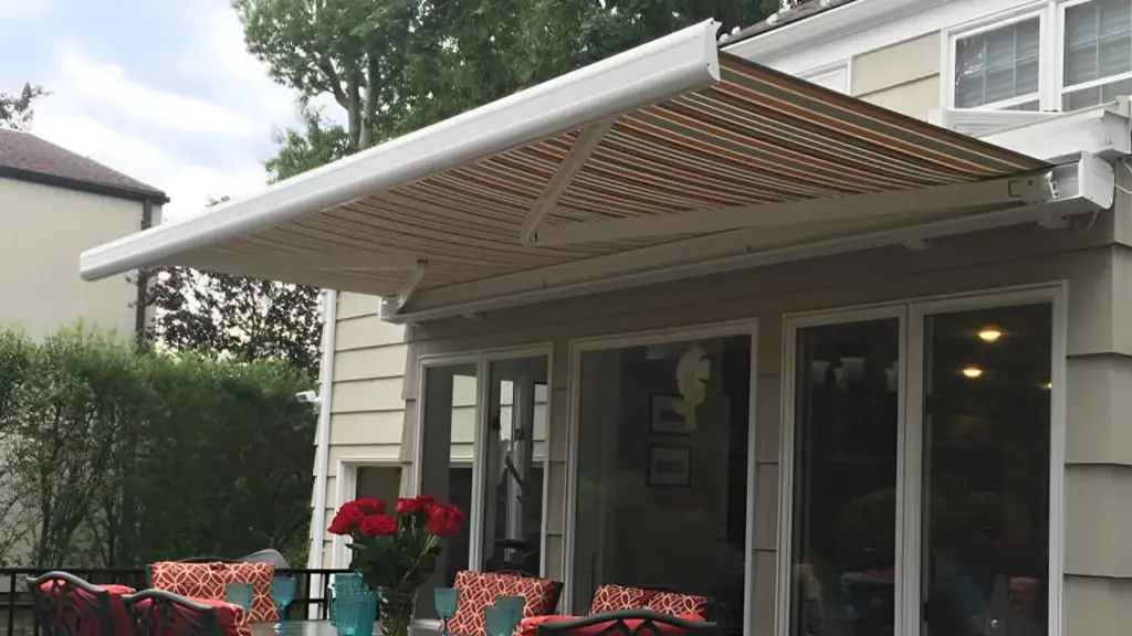 Striped Retractable Awning Over Patio Seating Area