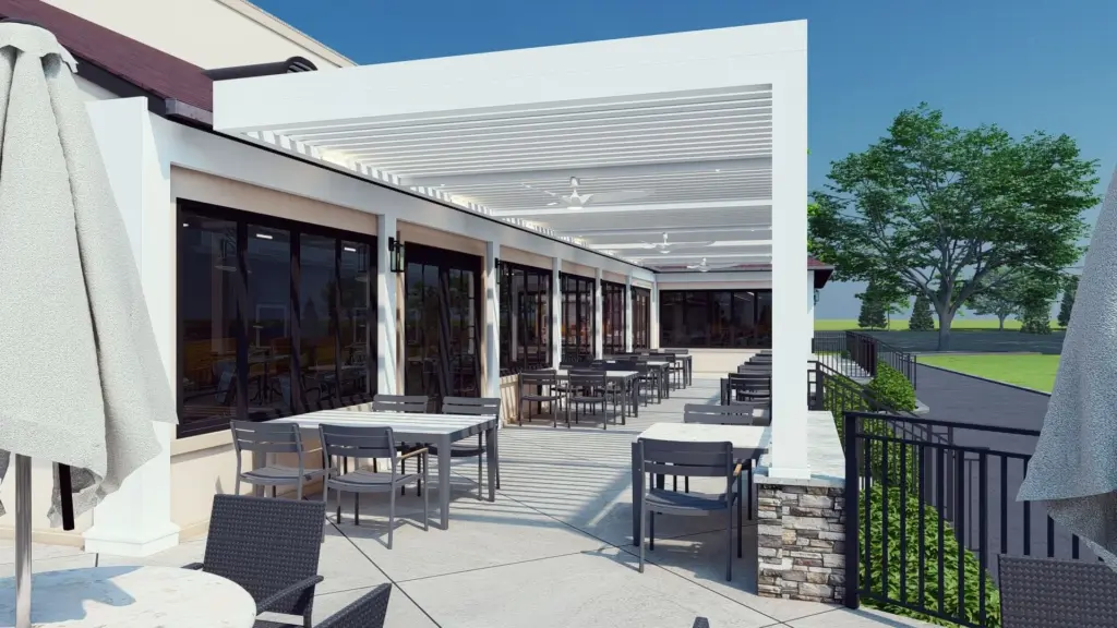 Outdoor dining space featuring a white pergola, patio seating, and a scenic view with trees in the background.